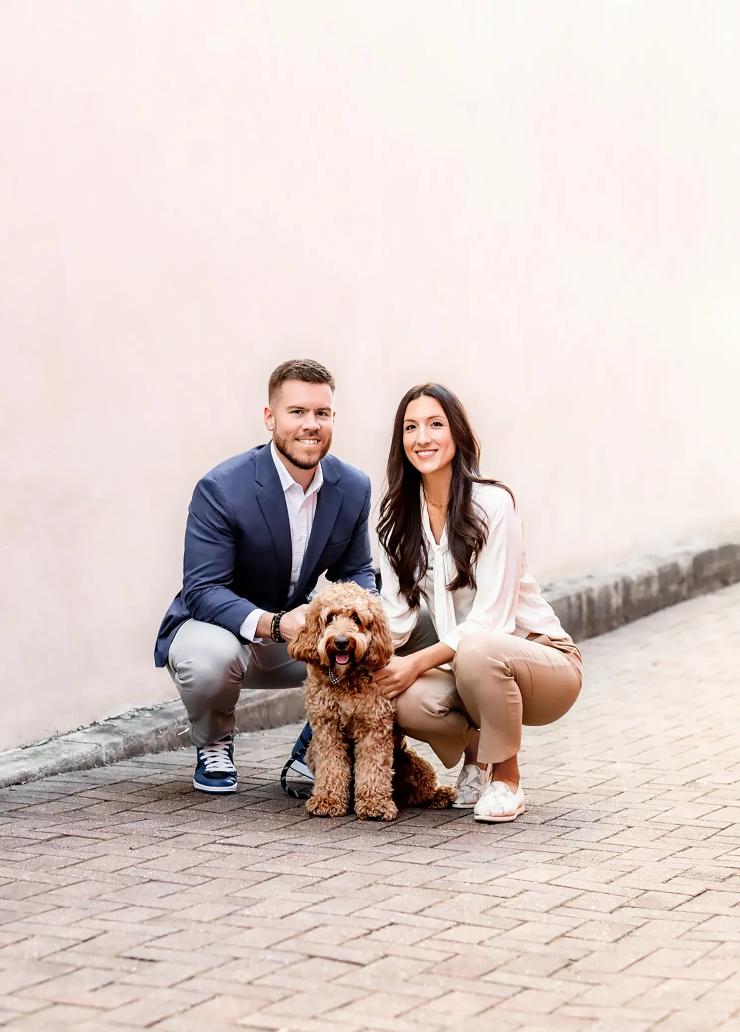 Dr. Tyler and Dr. Megan with Their Office Mascot at Axiom Chiropractic