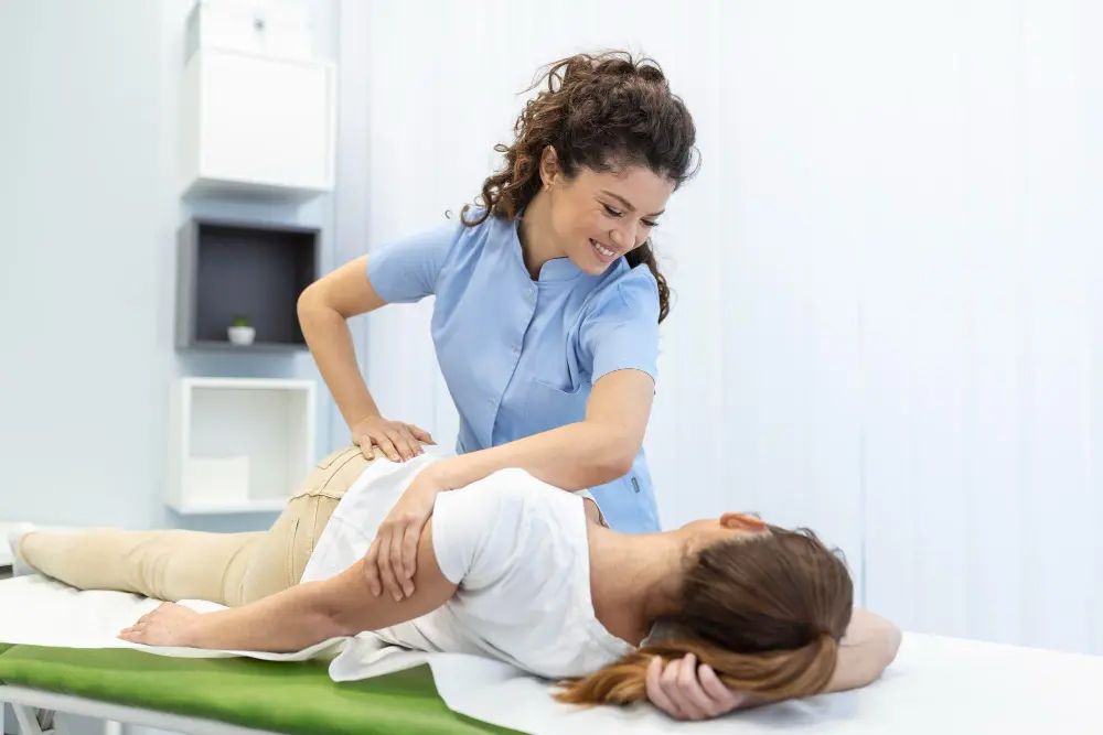 Chiropractor performing adjustment to help improve sleep quality