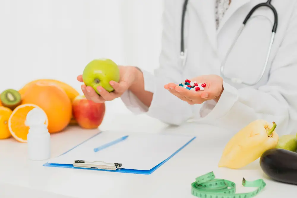 Patient consulting with functional medicine practitioner about ongoing symptoms