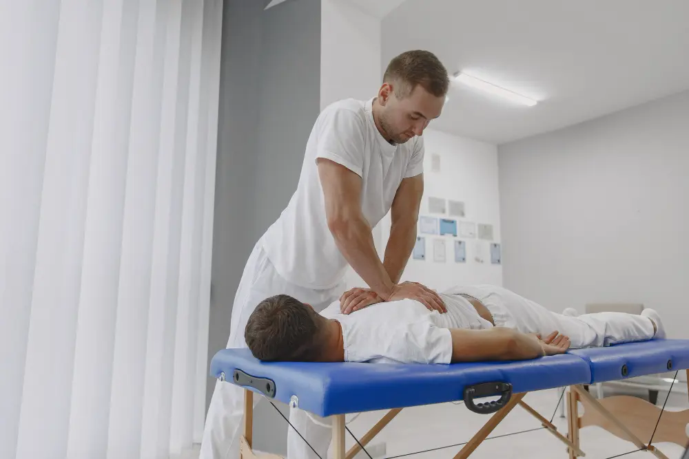 Chiropractor performing Gonstead technique spinal adjustment