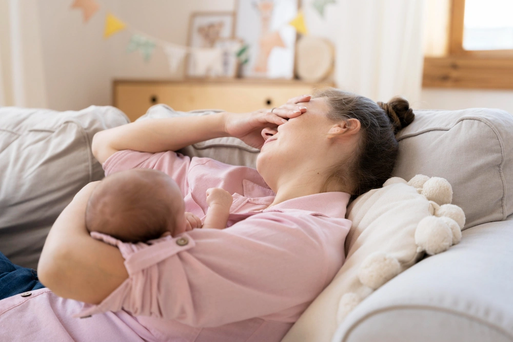 Postpartum woman receiving chiropractic care for recovery and alignment