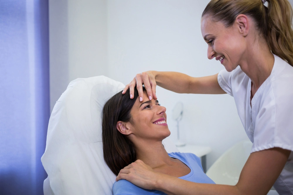 Woman holding head due to migraine linked to neck tension